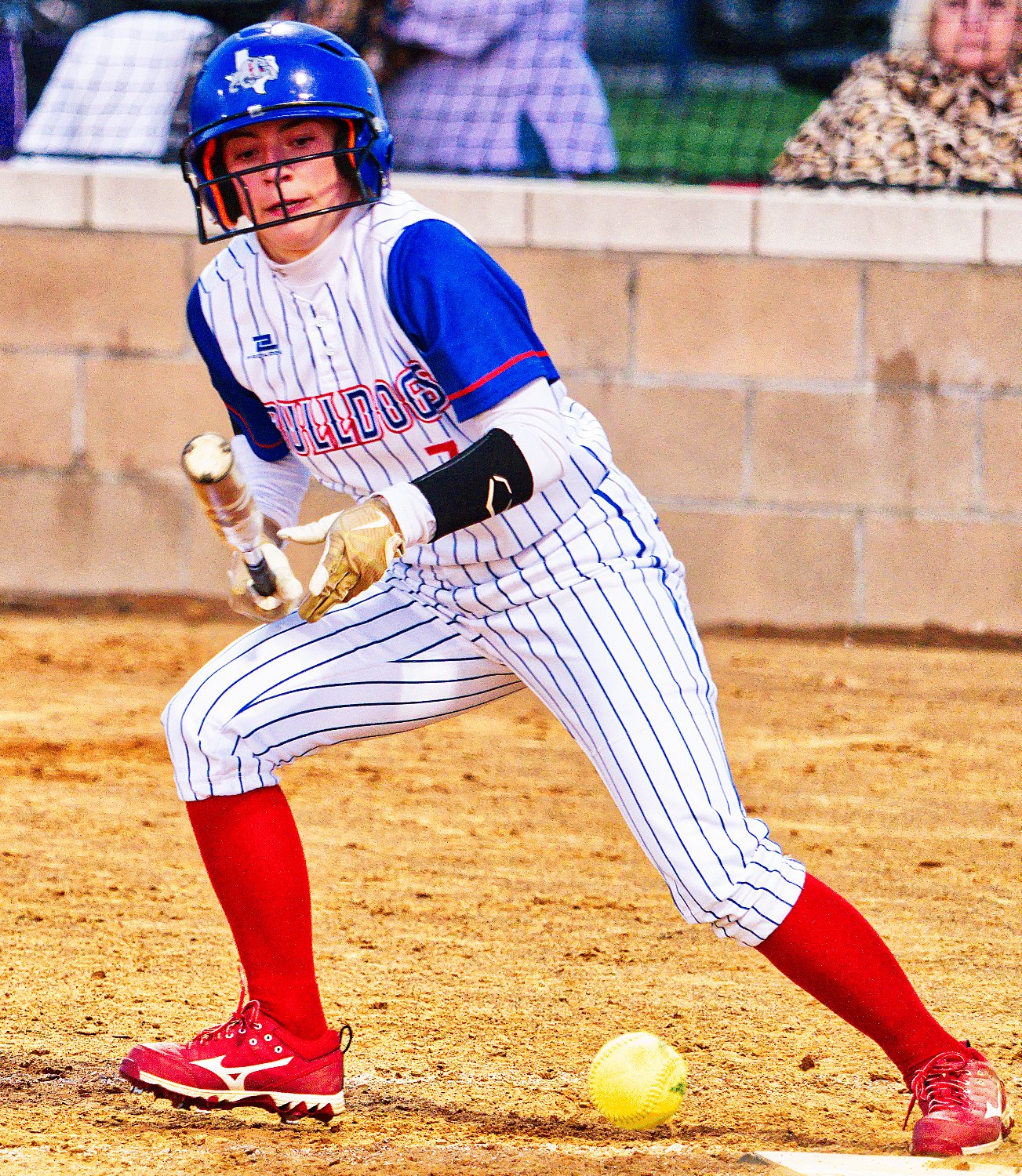 Addison Marcee lays down a bunt single to start the sixth inning. [see more softball]